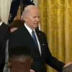 56272741-10690391-Joe_Biden_is_seen_wandering_around_the_East_Room_looking_for_som-m-33_1649219207633